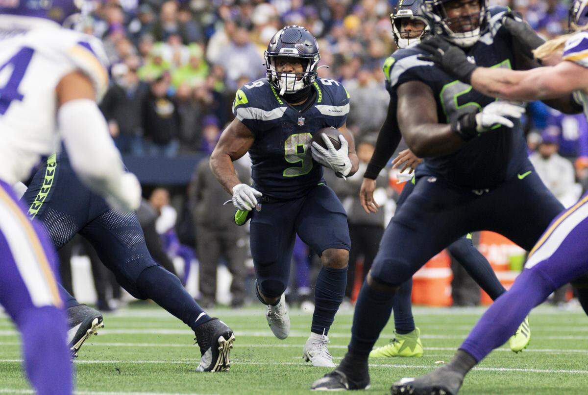 Seattle Seahawks running back Kenneth Walker III (9) runs the ball during the fourth quarter of the game against the Minnesota Vikings at Lumen Field, on Sunday, Dec. 22, 2024, in Seattle, Wash.