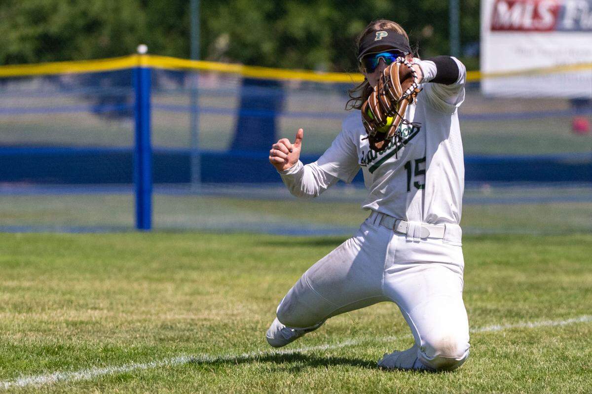 Peninsula right fielder Mira Sonnen makes a diving catch in foul territory during the bottom of the third inning of the Class 3A state championship game on Saturday, May 27, 2023, at the Regional Athletic Complex in Lacey, Wash.