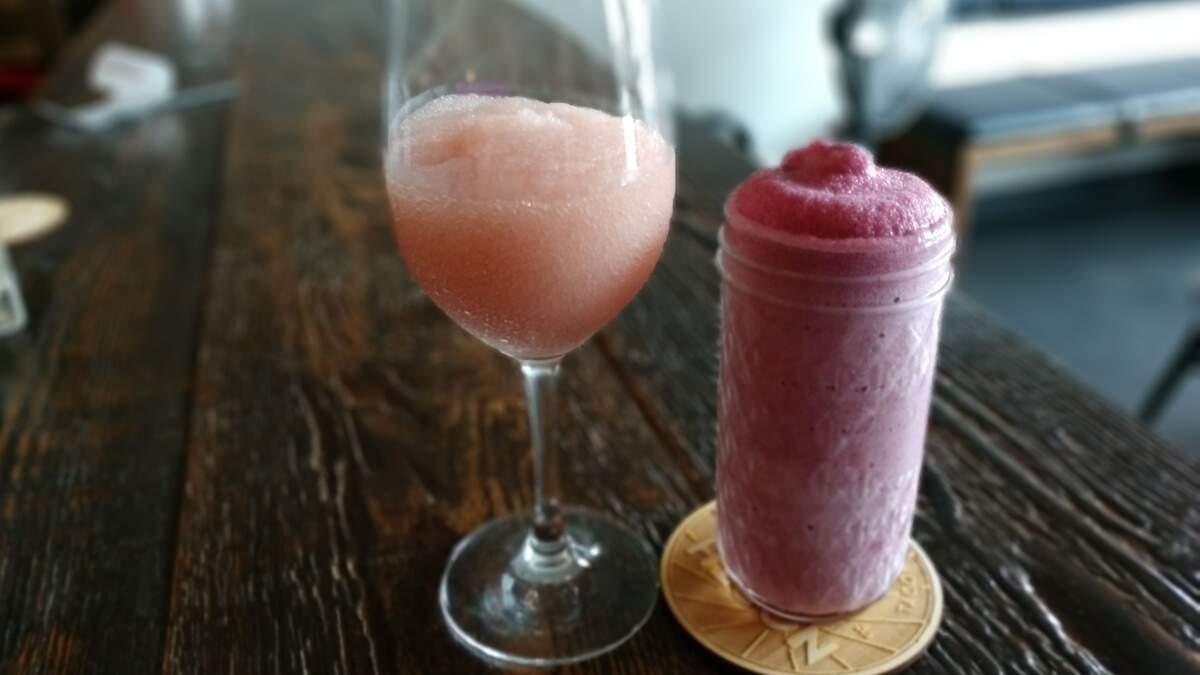 A glass of frozen wine (left) and frozen cider (right) from North End Social Club in Tacoma.