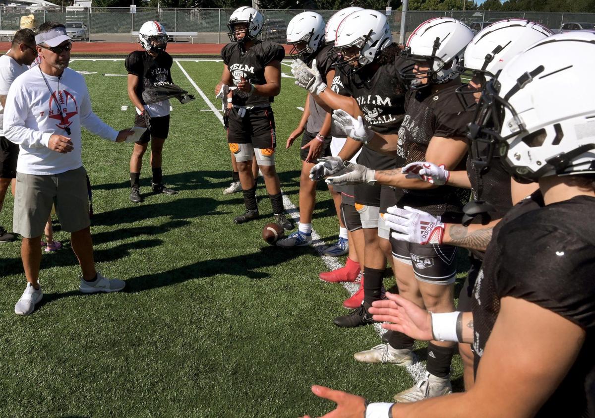 Yelm head coach Jason Ronquillo directs afternoon practice on Monday, August 22 as the Tornados prepare for the 2022 season