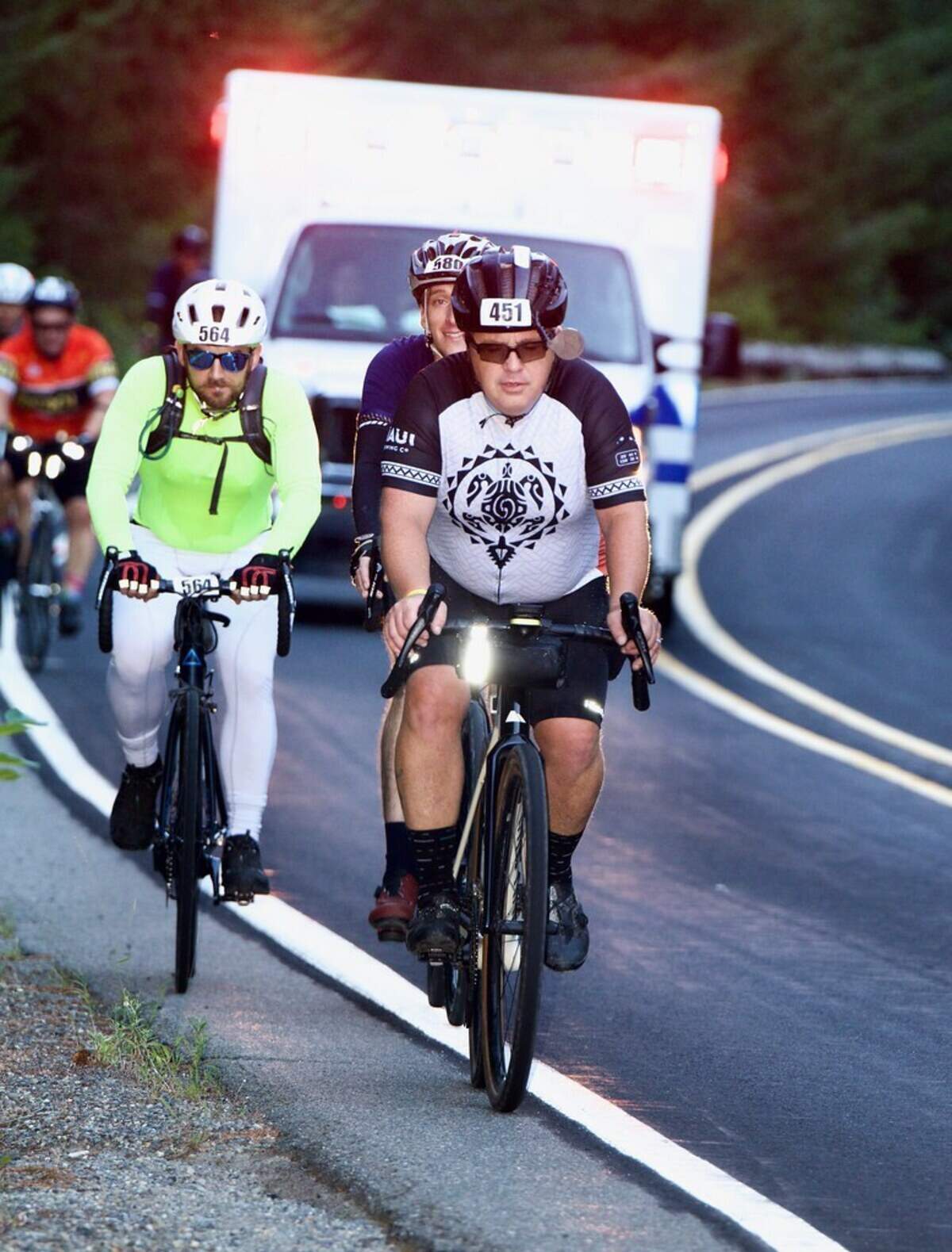 2024 RAMROD riders heading out of Enumclaw with EMS on their tails.