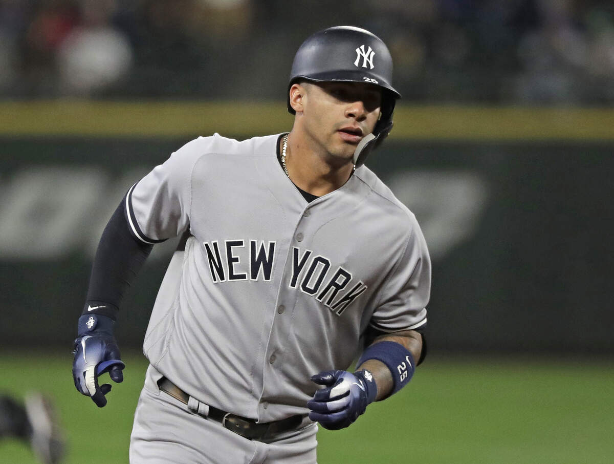 New York Yankees’ Gleyber Torres rounds the bases after he hit a two-run home run during the second inning of the team’s baseball game against the Seattle Mariners, Friday, Sept. 7, 2018, in Seattle. (AP Photo/Ted S. Warren)
