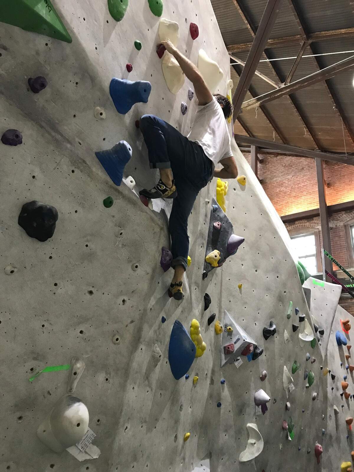 TNT outdoors reporter training for public lands at a climbing gym.