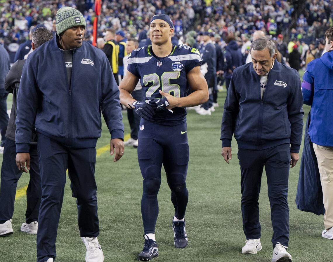 Seattle Seahawks running back Zach Charbonnet (26) comes off the field en route to the blue tent during the second quarter of the NFC Divisional Round game at Lumen Field, on Saturday, Jan. 17, 2026, in Seattle.