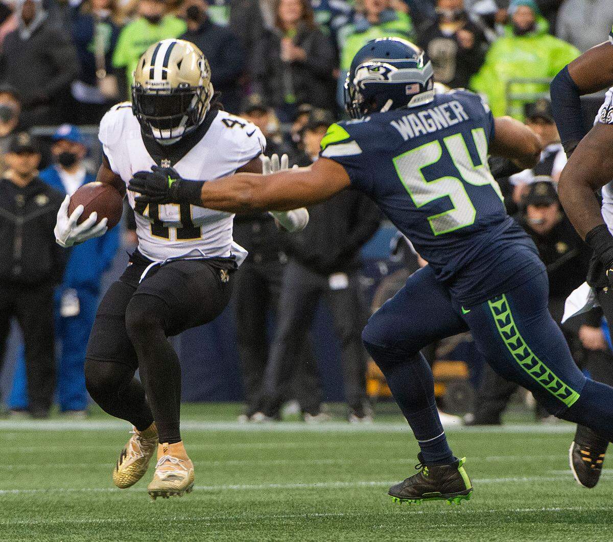 Seahawks linebacker bobby Wagner reels in Saints running back Alvin Kamara during an NFL game between the Seattle Seahawks and the New Orleans Saints at Lumen Field in Seattle on Monday, Oct. 25, 2021.