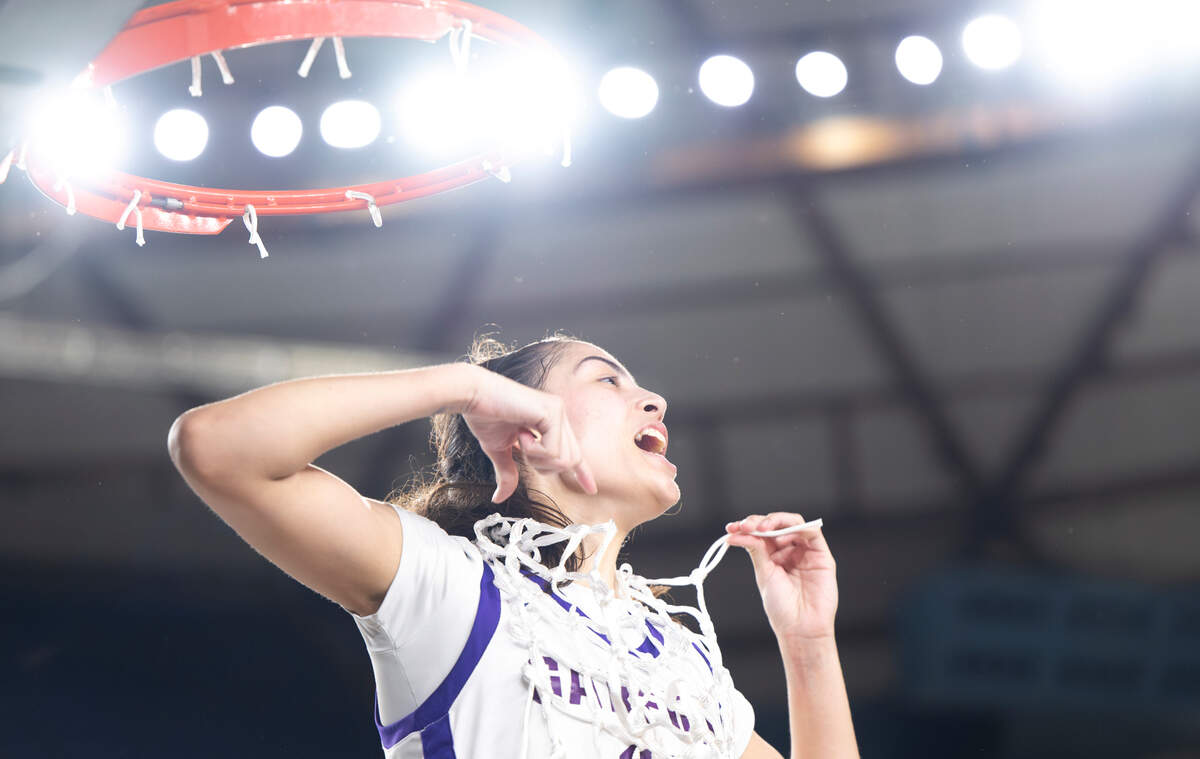 Garfield’s Katie Fiso (2) cuts the net down after their 62-59 victory over Mead in the Class 3A state championship game at the Tacoma Dome, on Saturday, March 2, 2024, in Tacoma, Wash.