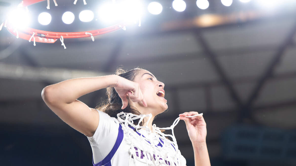 Garfield’s Katie Fiso (2) cuts the net down after their 62-59 victory over Mead in the Class 3A state championship game at the Tacoma Dome, on Saturday, March 2, 2024, in Tacoma, Wash.