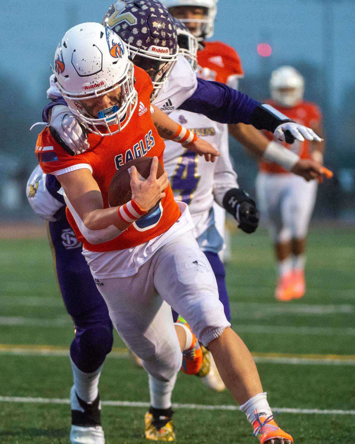 Graham Kapowsin running back Zack Lee (8) rushes in for a touchdown as Lake Stevens defensive back Isaac Redford (14) attempts to tackle him before crossing the goal line during the first quarter of the State 4A championship game on Saturday afternoon at Mount Tahoma Stadium in Tacoma.