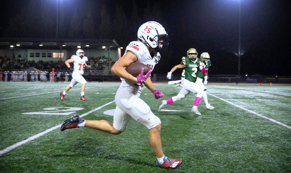 Yelm kick returner Anthony Kiamco returns a punt against the Timberline Blazers during Friday night’s 3A SSC football game at South Sound Stadium in Lacey, Washington, on Oct. 13, 2023.