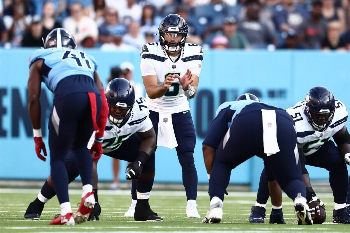 Aug 17, 2024; Nashville, Tennessee, USA; Seattle Seahawks quarterback Sam Howell (6) sets up before a play against the Tennessee Titans at Nissan Stadium. Mandatory Credit: Casey Gower-USA TODAY Sports