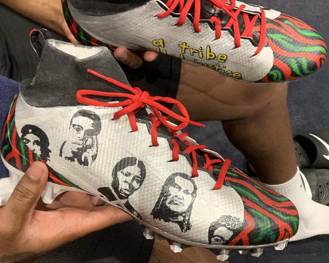 Seahawks defensive end Quinton Jefferson shows off his shoes he will wear Sunday night in his game at the Los Angeles Rams for the NFL’s annual My Cause My Cleats initiative. Jefferson’s were designed by teens in Creative Justice, the King Country program giving youth facing a non-violent charge the opportunity for mitigation through a 12-week art program.