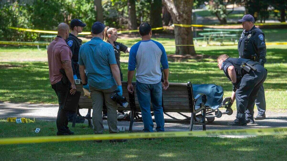 A man who was found dead in Tacoma’s Wright Park is loaded onto a stretcher Saturday morning July 24, 2021. Tacoma police are investigating it as a homicide.