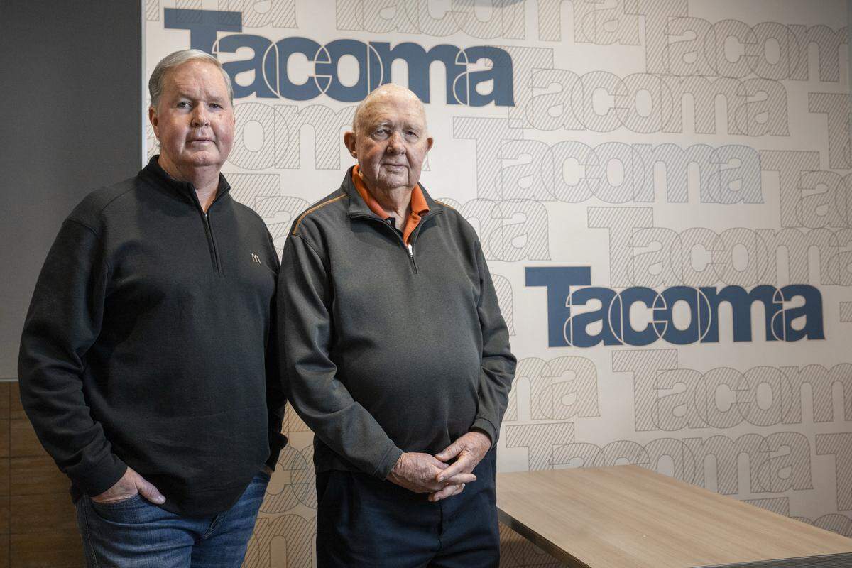 Pat Maher, left, and father Ed Maher stand inside the McDonald's on Tacoma Avenue on Friday, Dec. 19, 2025, in Tacoma, Wash. Ed, 85, purchased the McDonald's in 1982, and Pat is the current owner and operator.