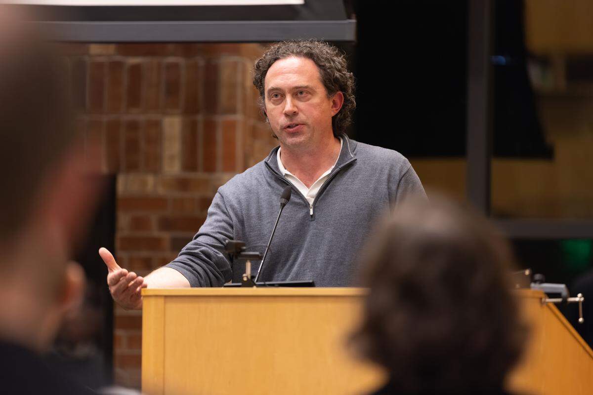 Professor Justin Tiehen speaks at the 53rd annual Regester Lecture at the University of Puget Sound on Nov. 13, 2025, titled “Dating a Zombie: AI Romantic Companions and the Question of Consciousness.”