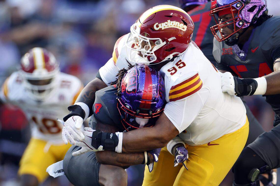 FORT WORTH, TEXAS - NOVEMBER 8: Jordyn Bailey #4 of the TCU Horned Frogs is wrapped up by Domonique Orange #95 of the Iowa State Cyclones during the first half at Amon G. Carter Stadium on November 8, 2025 in Fort Worth, Texas. (Photo by Ron Jenkins/Getty Images)