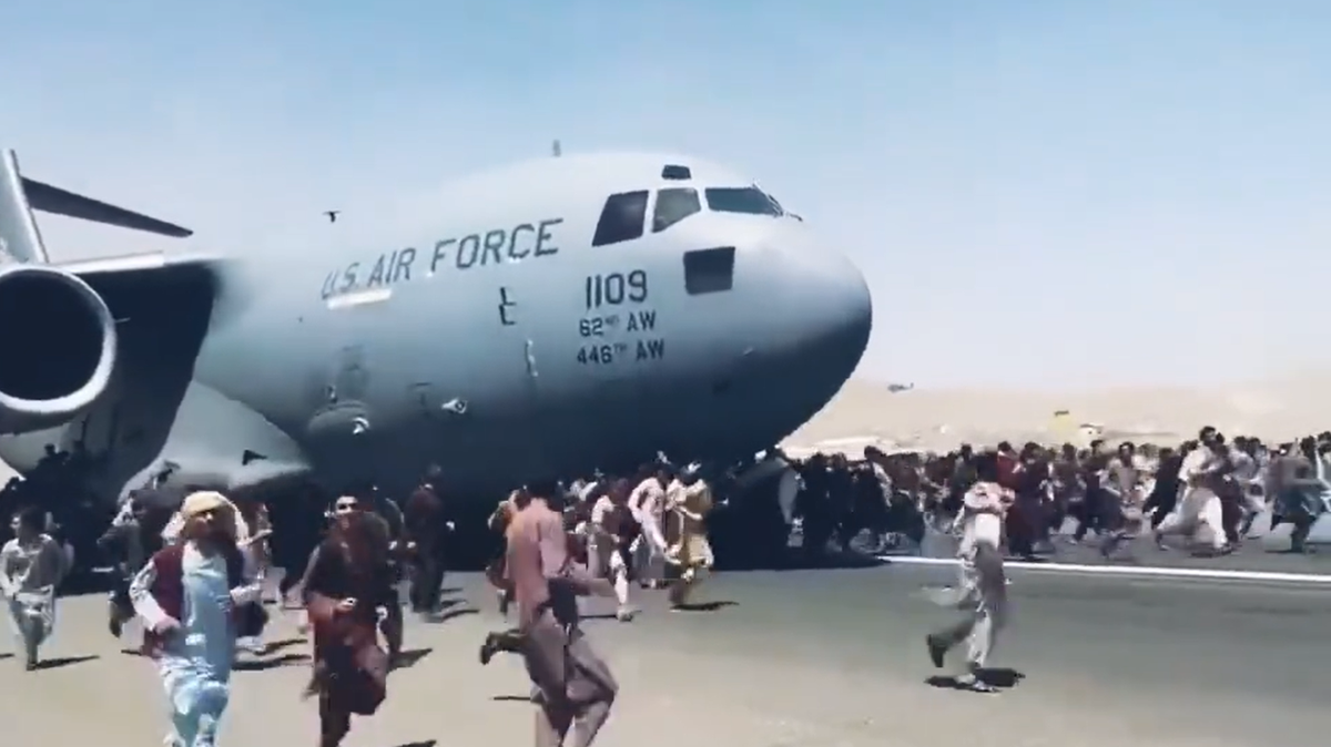 A frame from video posted to Twitter Monday shows a U.S. Air Force jet with “62nd AW” and “446th AW” painted on its side.