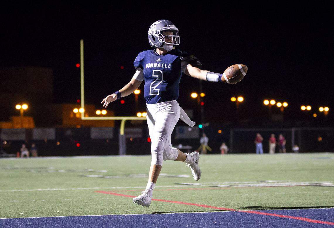 Quarterback Spencer Rattler (2) of the Pinnacle Pioneers runs the ball in for a touch-down against the Perry Pumas at Pinnacle High School on Friday, August 17, 2018 in Phoenix, Arizona.