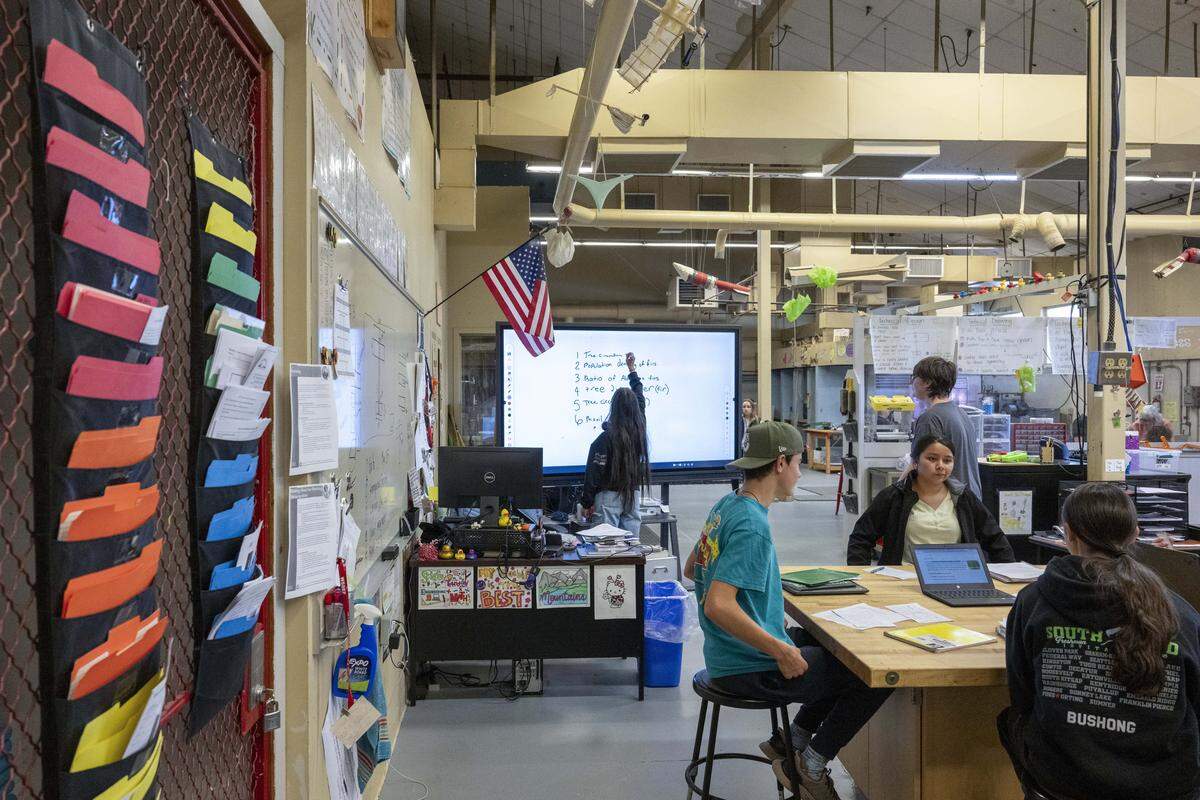 Orting High School students take part in a STEM class in a space that used to house shop classes on Wednesday, Oct. 15, 2025, in Orting, Wash. These courses would be moved to a new Career and Technical Education wing with dedicated spaces for STEM learning if the Orting School District's $137 million bond were to pass.