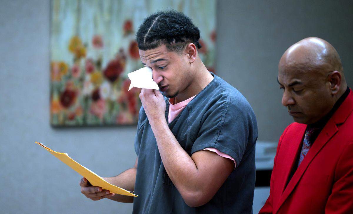 Elijah James Goode Mitchell wipes away tears as he speaks during his sentencing hearing in Pierce County Superior Court in Tacoma, Washington, on Friday, April 26, 2024. Mitchell was sentenced on a plea agreement in the shooting death of his friend, Lavonte Fleming in 2019.
