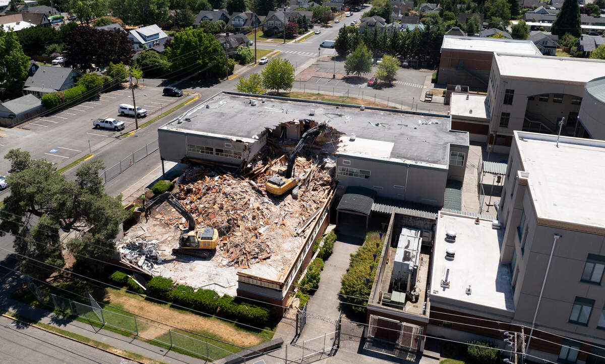 Crews demolish Puyallup High’s Library, Science & Art Building on Tuesday, July 15, 2025, in Puyallup, Wash.