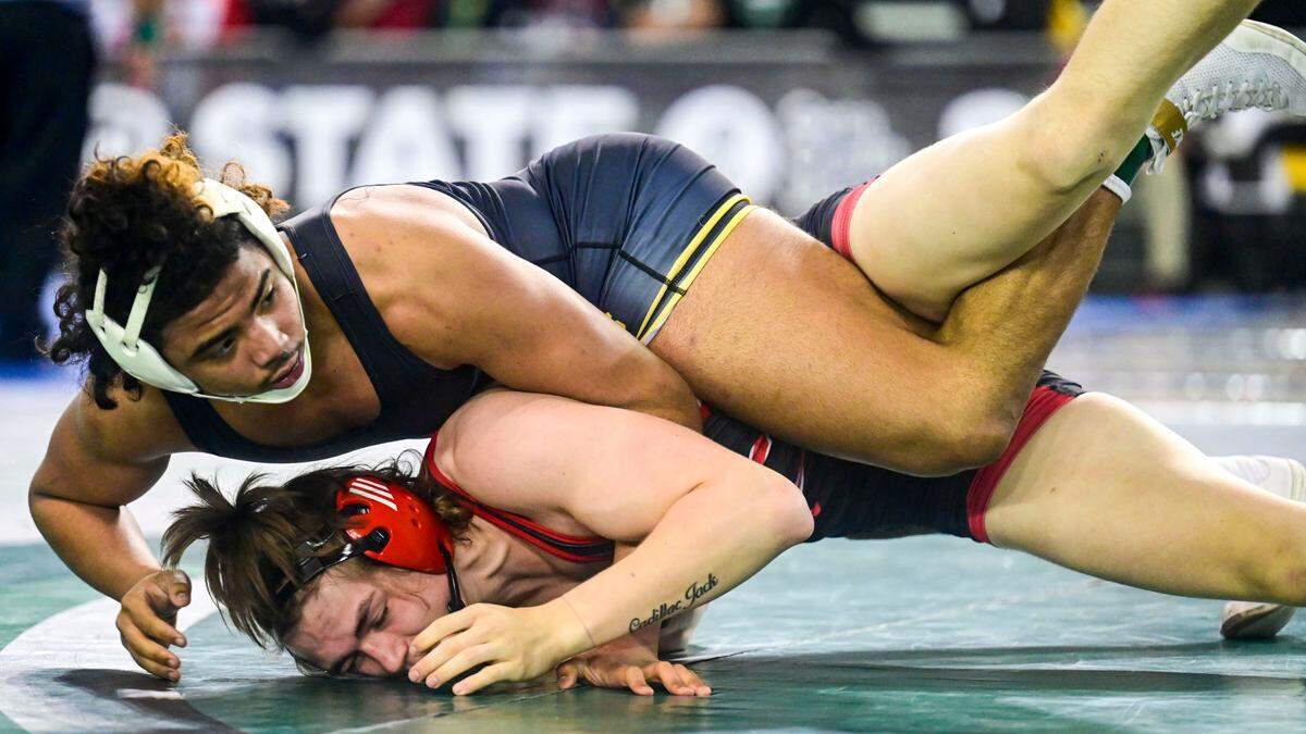 Lincoln’s Navarre Dixon does his best to keep Cheney’s Ezra Anderson in bounds during the second round of their 182-pound 3A quarterfinal match at Mat Classic XXXIII on Friday, Feb. 18, 2022, in Tacoma, Wash. Dixon pinned Anderson in 3 minutes, 13 seconds.