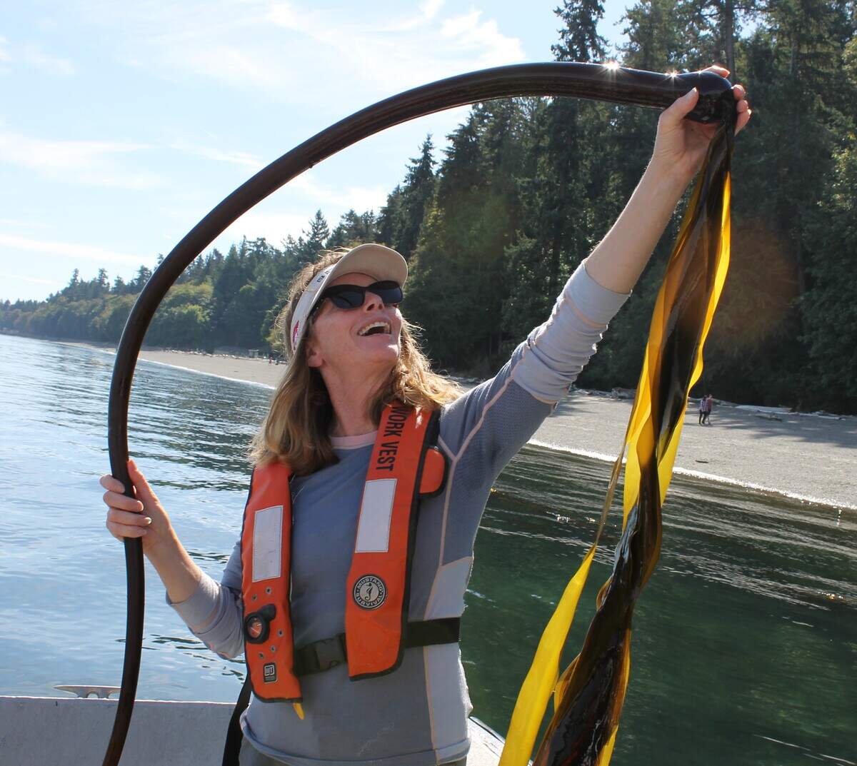 Lead Department of Natural Resources researcher Helen Berry holds a piece of bull kelp on Thursday, Sept. 12, 2019. Research shows the kelp is dying in southern parts of Puget Sound.