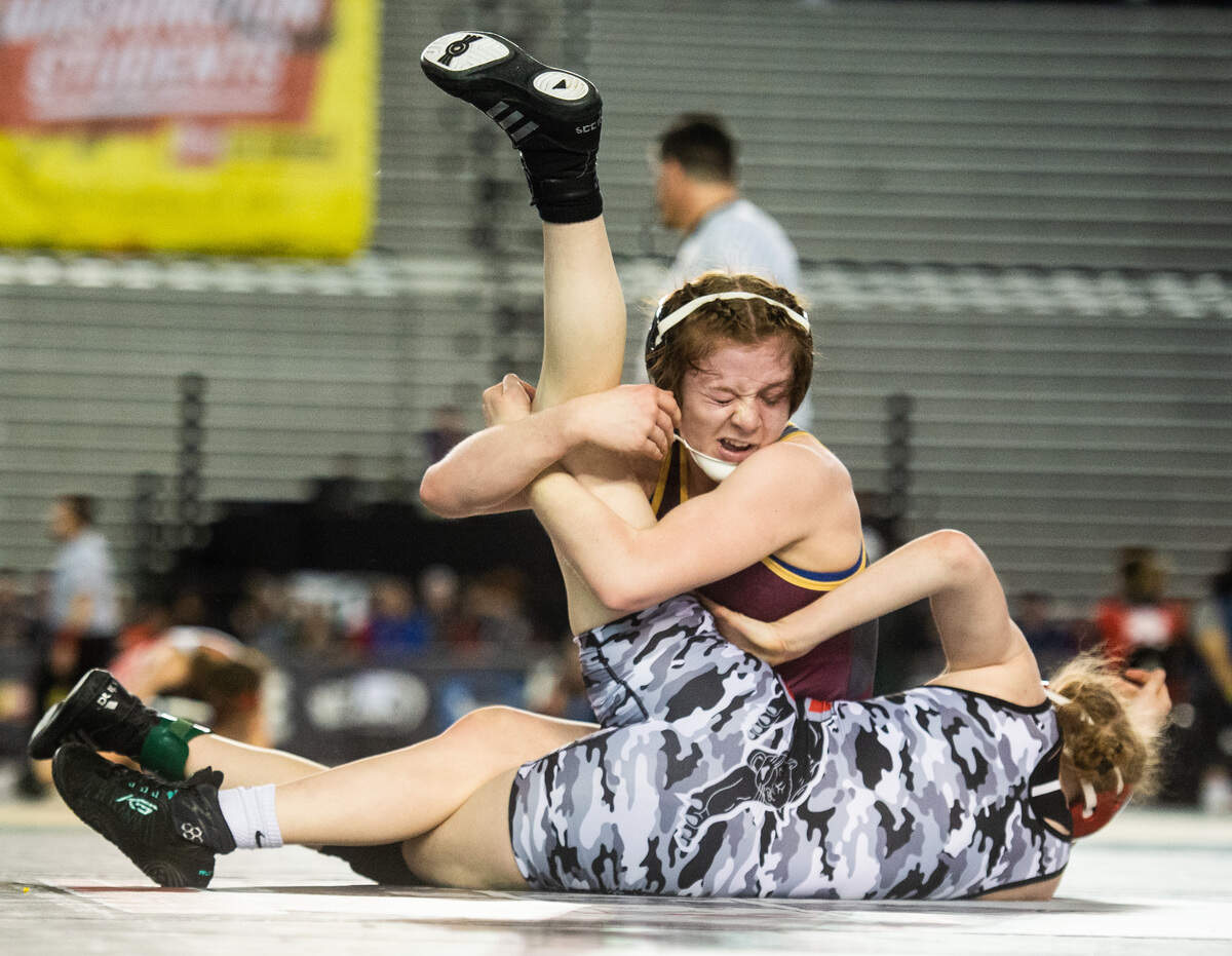 White River’s Shelby Moore tries to pin Snohomish’s Mikayla Jardine during day one of Mat Classic XXXII at the Tacoma Dome in Tacoma, Wash., on Friday, Feb. 21, 2020.