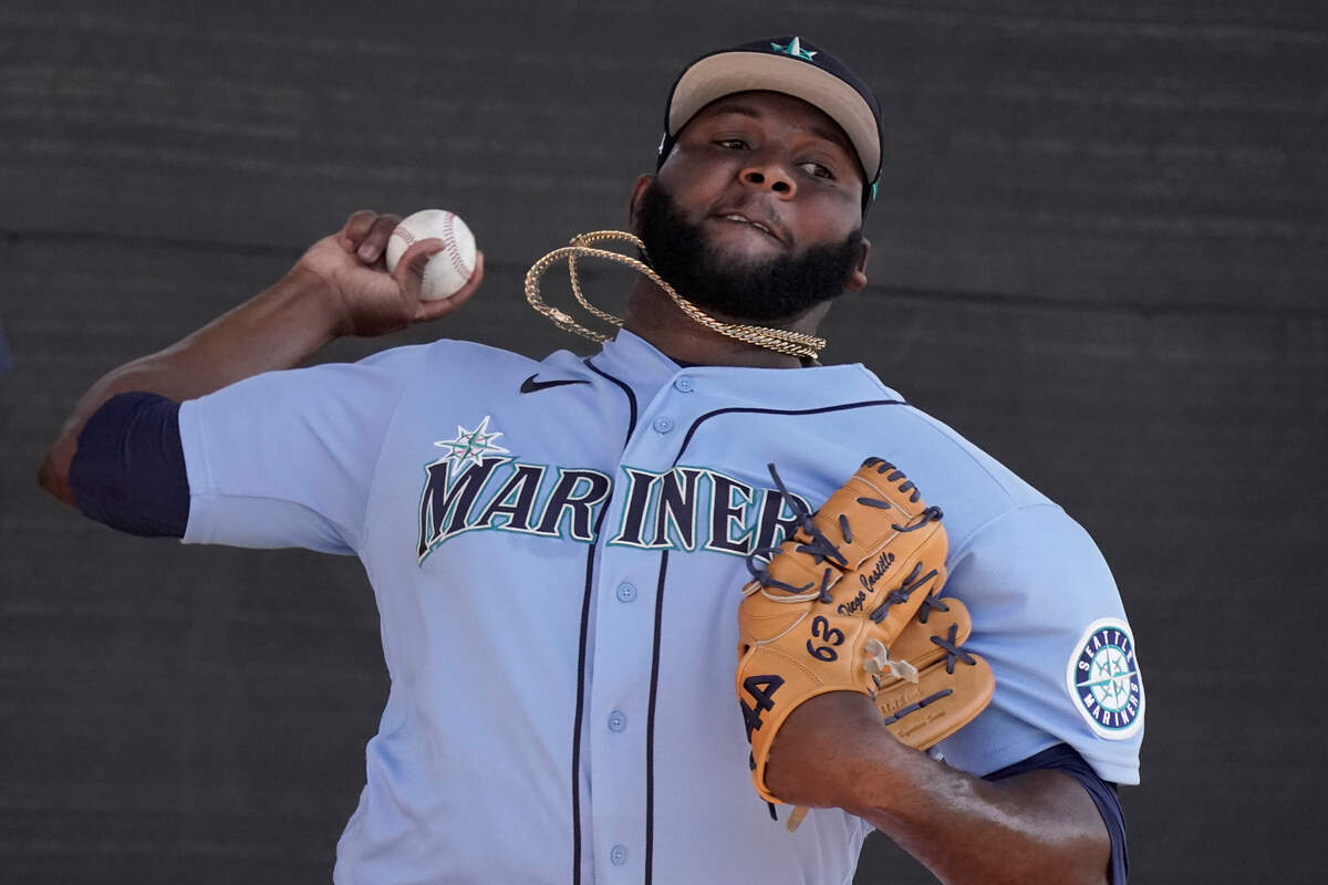 Seattle Mariners pitcher Diego Castillo throws during spring training baseball practice Wednesday, March 16, 2022, in Peoria, Ariz. (AP Photo/Charlie Riedel)