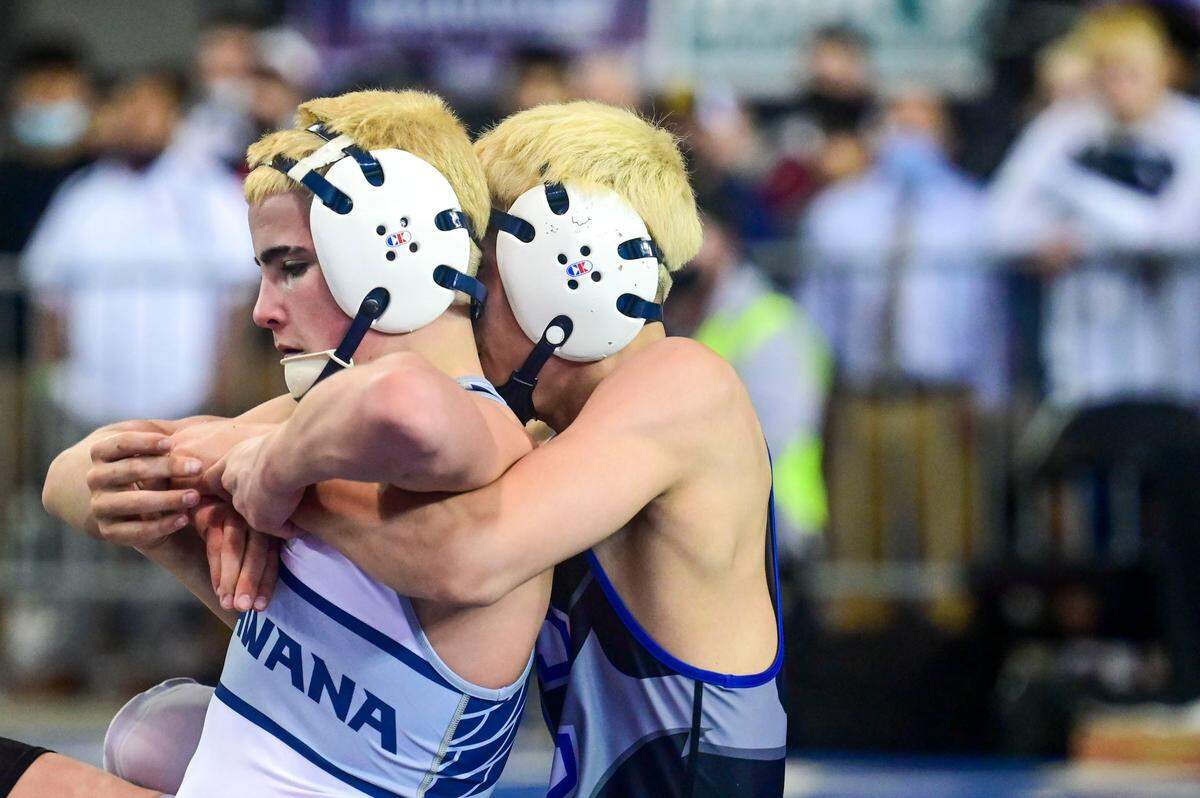 Chiawana’s Dalton Johnson (right) attempts to get a hold of Isaiah Medina, also of Chiawana, during their 113-pound 4A championship match at Mat Classic XXXIII on Saturday, Feb. 19, 2022, at the Tacoma Dome in Tacoma, Wash. Medina, a junior, beat his teammate, 6-1. The two took a bow together after the match was finished.