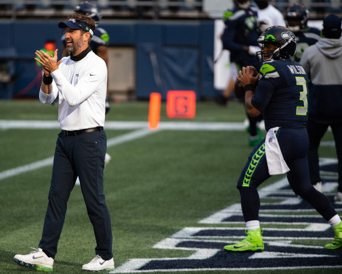 Offensive coordinator Brian Schottenheimer claps on the field during warms up. The Seattle Seahawks played the New England Patriots in a NFL football game at CenturyLink Field in Seattle, Wash., on Sunday, Sept. 20, 2020.