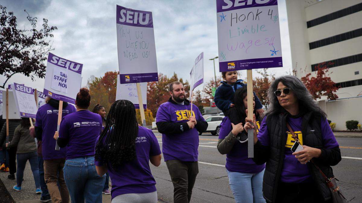 Workers represented by SEIU Healthcare 1199NW held an informational picket Oct. 23 outside St. Joseph Medical Center in Tacoma over contract talks that have continued for more than a year.