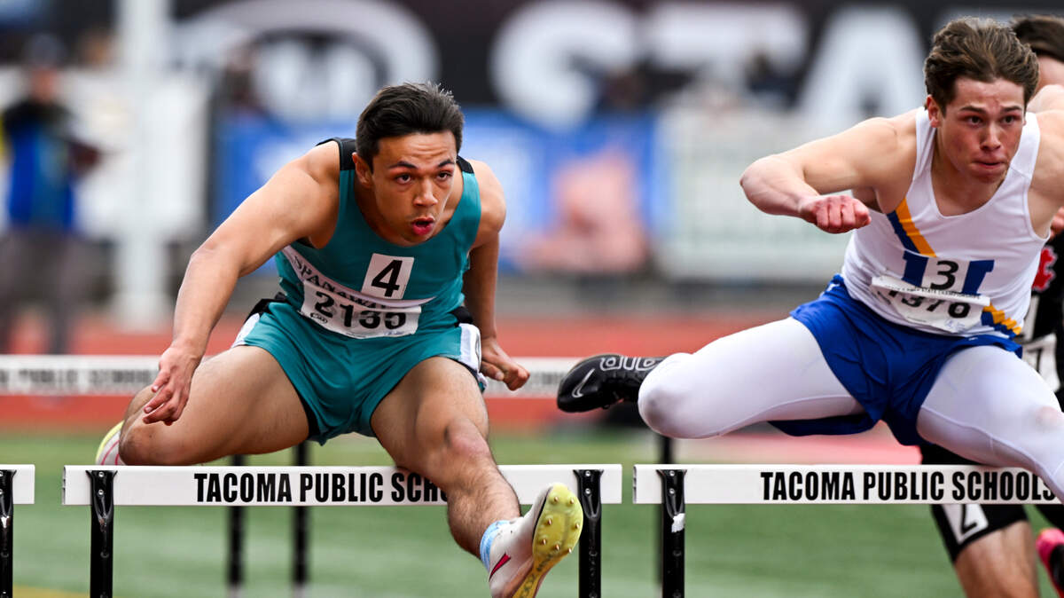 Spanaway Lake’s Andrew Bell is neck and neck with Mead’s Jaeland Leman in the 3A boys 110m hurdles during day 2 of the Track and Field Championship at Mount Tahoma High School, on Friday, May 24, 2024, in Tacoma, Wash.