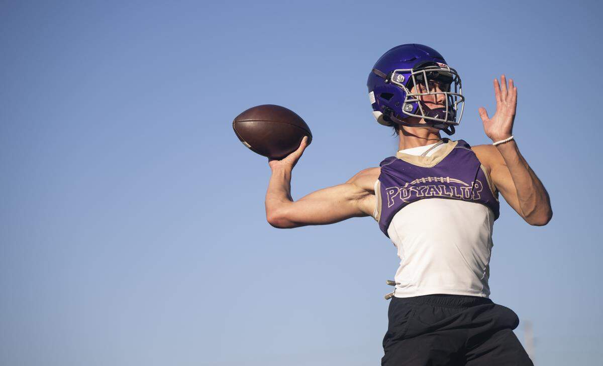 Puyallup quarterback Luke Parker throws during a Puyallup High School football practice at Sparks Stadium on Thursday, Aug. 21, 2025, in Puyallup, Wash.