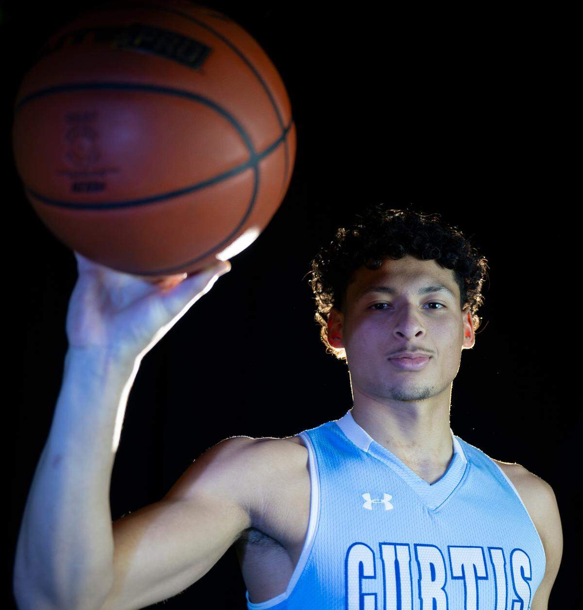 Curtis’ Devin Whitten poses for a portrait after being selected as The News Tribune’s 2023 All-Area basketball first team, at Silas High School, on Sunday, March 17, 2024 in Tacoma, Wash.