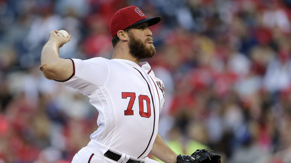Washington Nationals relief pitcher Austin Adams pitches during a baseball game against the Pittsburgh Pirates, Sunday, Oct. 1, 2017, in Washington. (AP Photo/Mark Tenally)