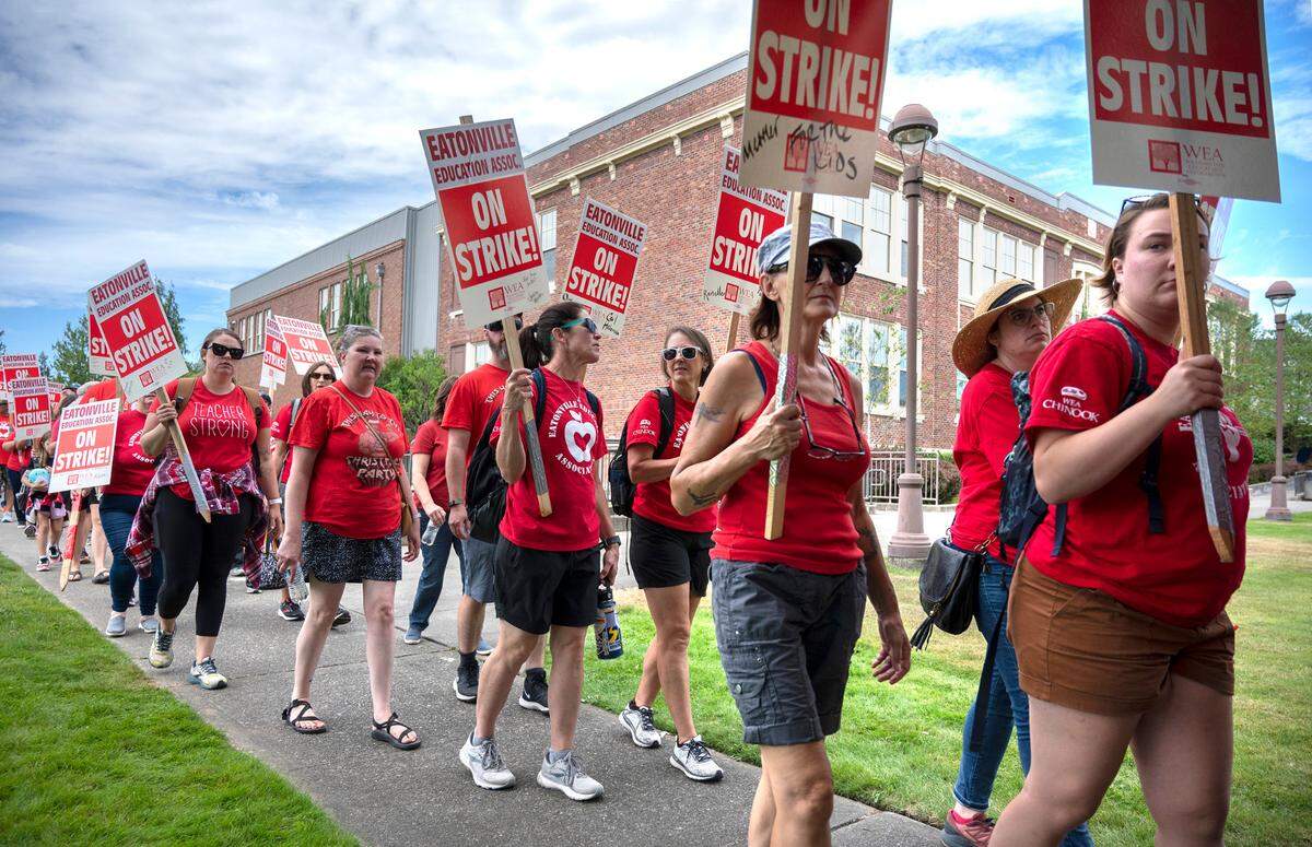 Eatonville teachers picket outside Eatonville High School on what should have been the first day of classes in the school district in Eatonville, Washington on Wednesday, Sept. 7, 2022, after union and district failed to reach a contract agreement by the Tuesday night deadline.