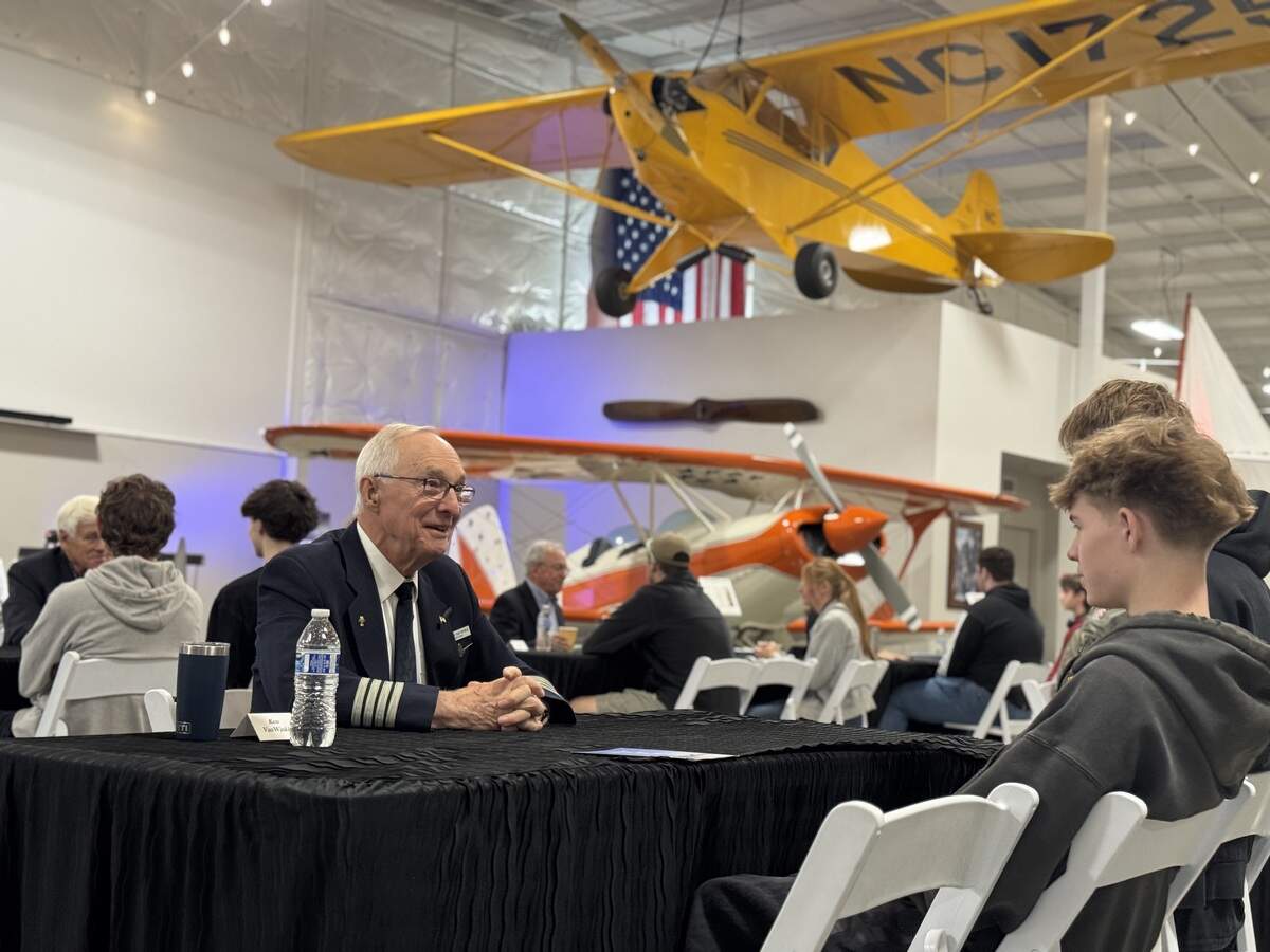 Aviation Academy students speak with Ken VanWinkle, a retired United Airlines captain and flight instructor with more than 25,000 flight hours, during a field trip to Gig Harbor Vintage Aero Museum Tuesday, Oct 21, 2025, near Gig Harbor, Wash.