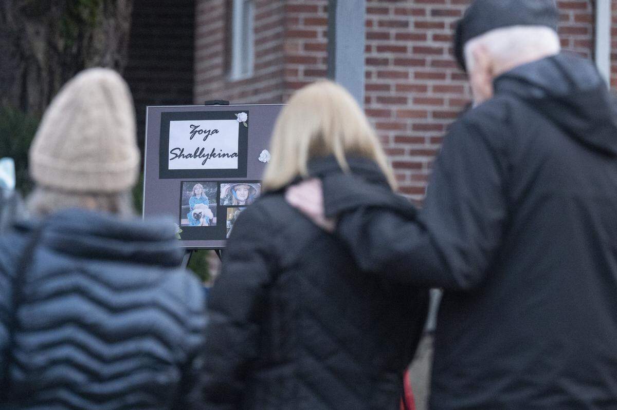 Memorial plaques for the victims of last month's stabbing attack sit on a stage at Skansie Brothers Park during a community vigil for the victims on Wednesday, March 4, 2026, in Gig Harbor, Wash.