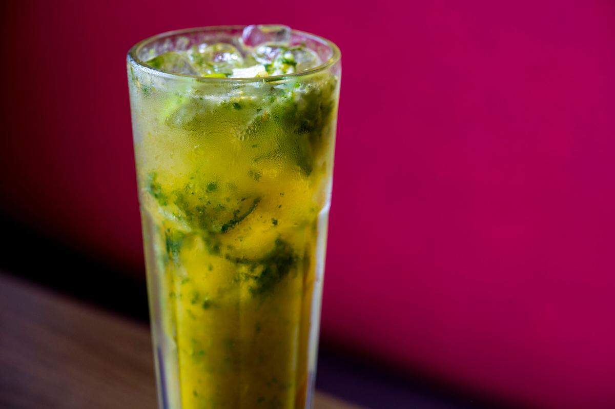 The drink menu features freshly muddled mojitos with the option of fresh fruit juice, including passionfruit and guava.