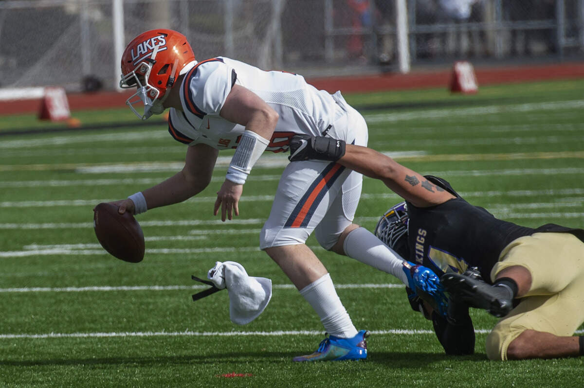 Puyallup defensive lineman Sermon Wilson menaced Lakes quarterback Justin Brennan all game, including this sack which thwarted a first quarter drive. The Vikings rolled to a 44-16 victory over the Lancers at Sparks Stadium in Puyallup Saturday, Feb. 27, 2021.