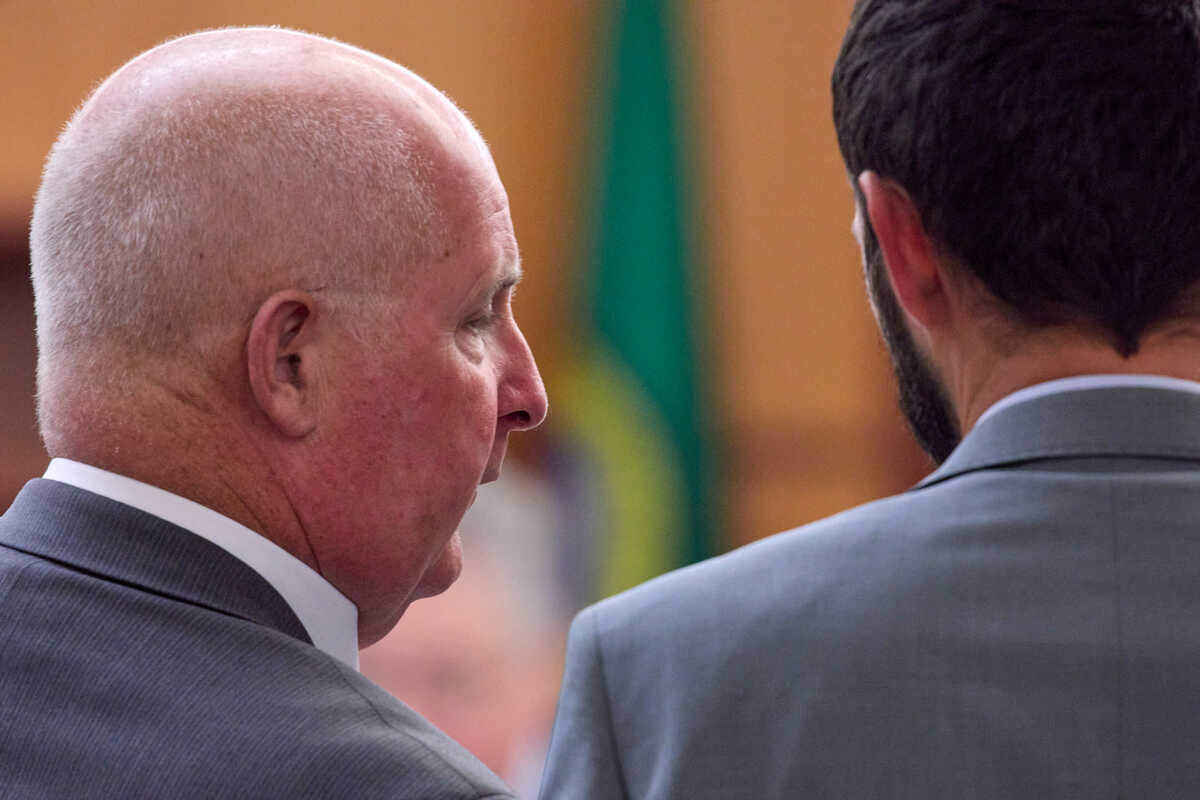 Attorney Brett Purtzer, left, talks with his client, officer Christopher “Shane” Burbank, right, during the trial of Tacoma Police officers accused in the death of Manny Ellis held at Pierce County Superior Court, Thursday, Oct. 26, 2023, in Tacoma, Wash. Officers Christopher Burbank, Matthew Collins and Timothy Rankine are charged. (John Froschauer / Pool Photo - AP)