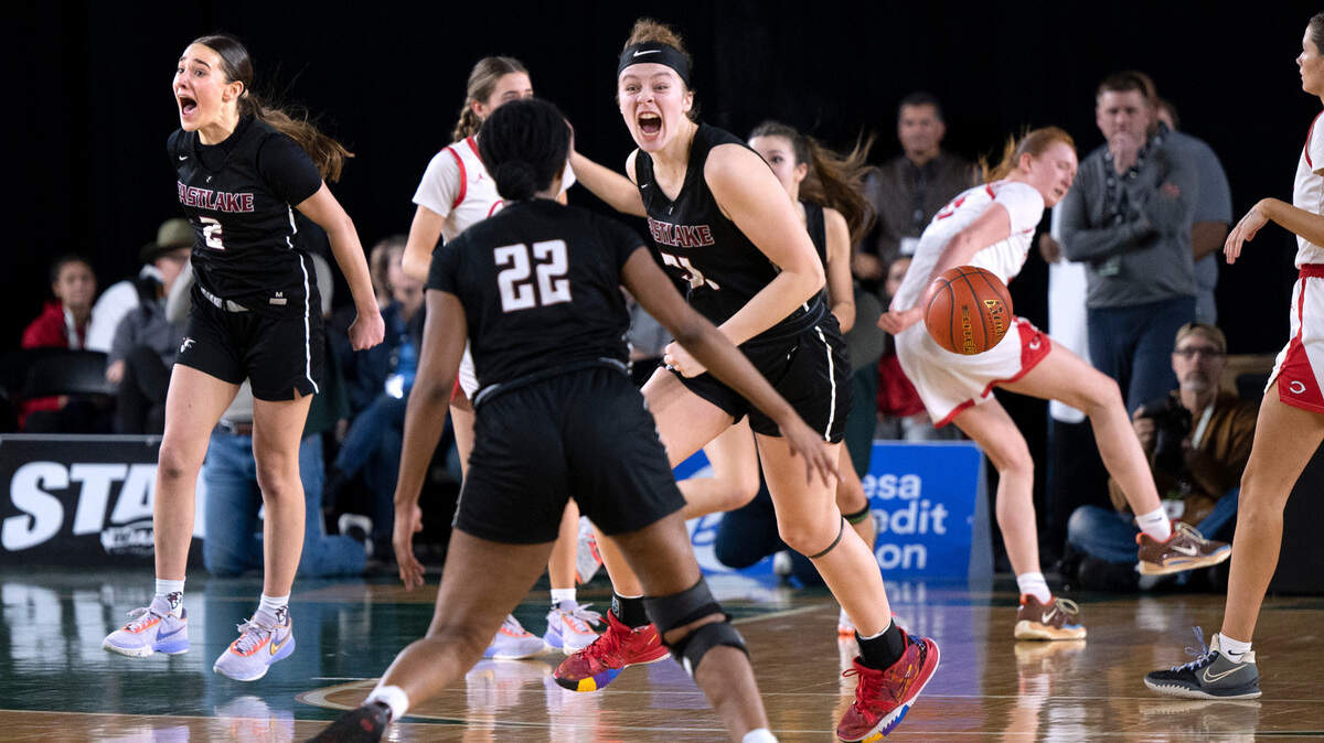 Eastlake’s Sofia Aluas (2), Kaylia Jackson (22), and Ava Schmidt celebrate as time expires in their 48-41 victory over the Camas Papermakers in the 4A girls state title game at the WIAA state basketball tournament in the Tacoma Dome in Tacoma, Washington, on Saturday, March 4, 2023.