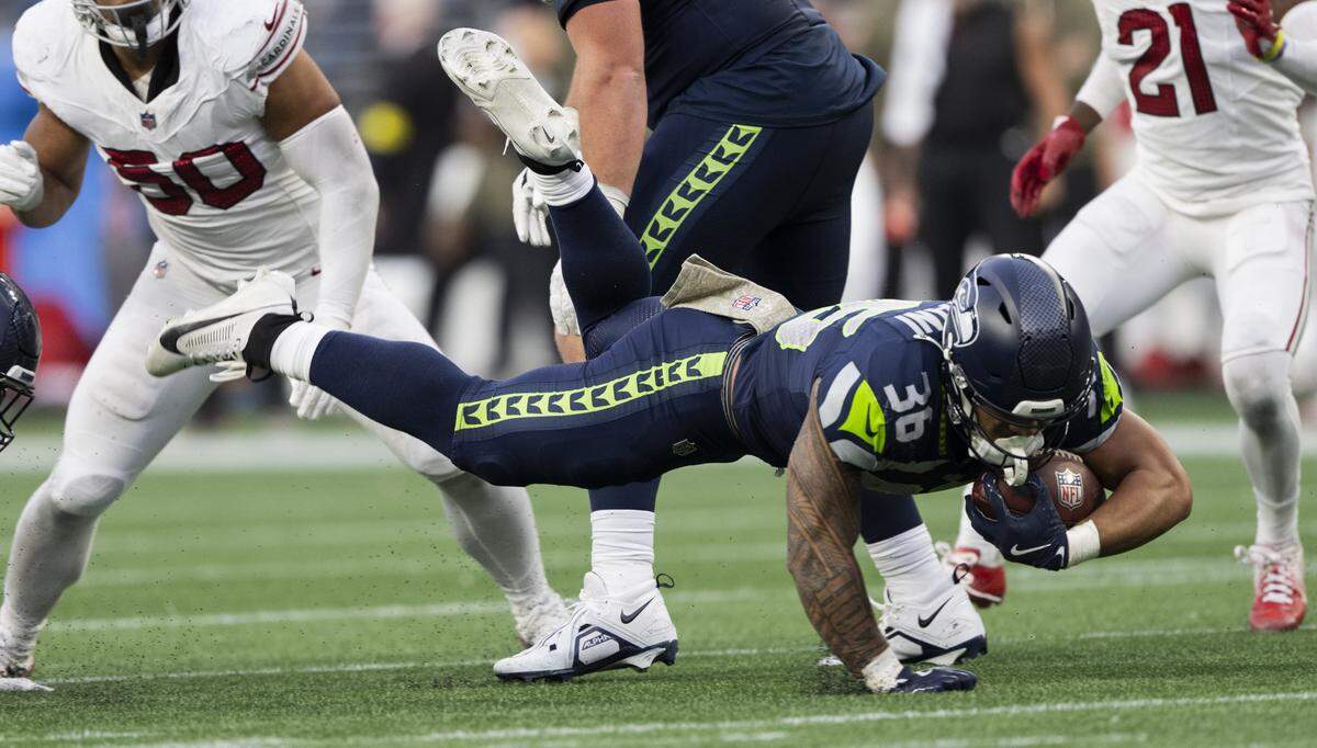 Seattle Seahawks running back George Holani (36) stretches out on the carry against the Arizona Cardinals during the fourth quarter of the game at Lumen Field, on Sunday, Nov. 9, 2025, in Seattle.