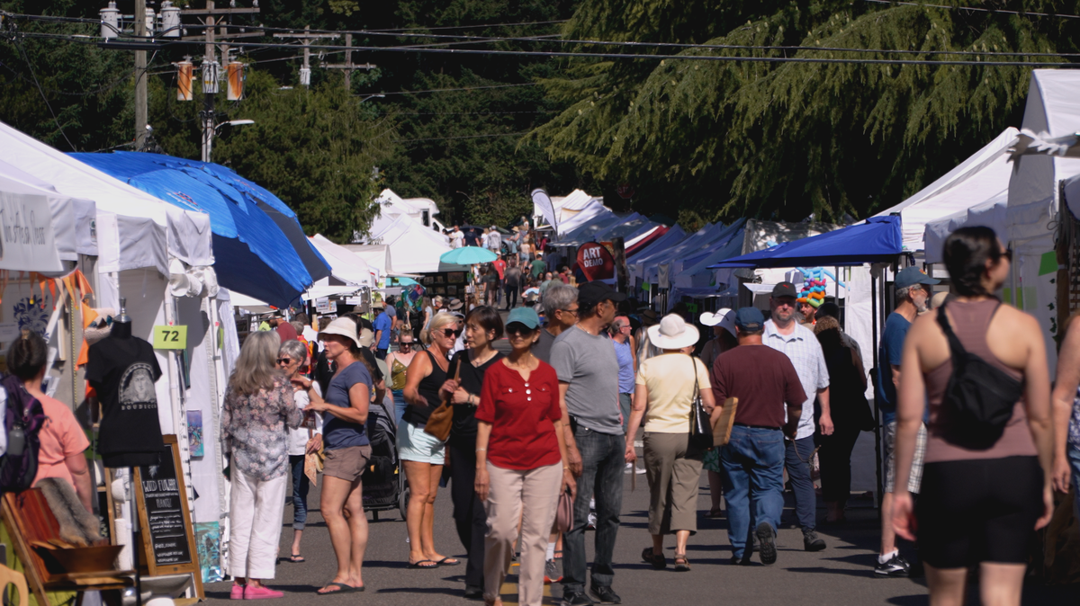 Visitors stroll through the 2023 Summer Art Festival on Judson Street in downtown Gig Harbor.