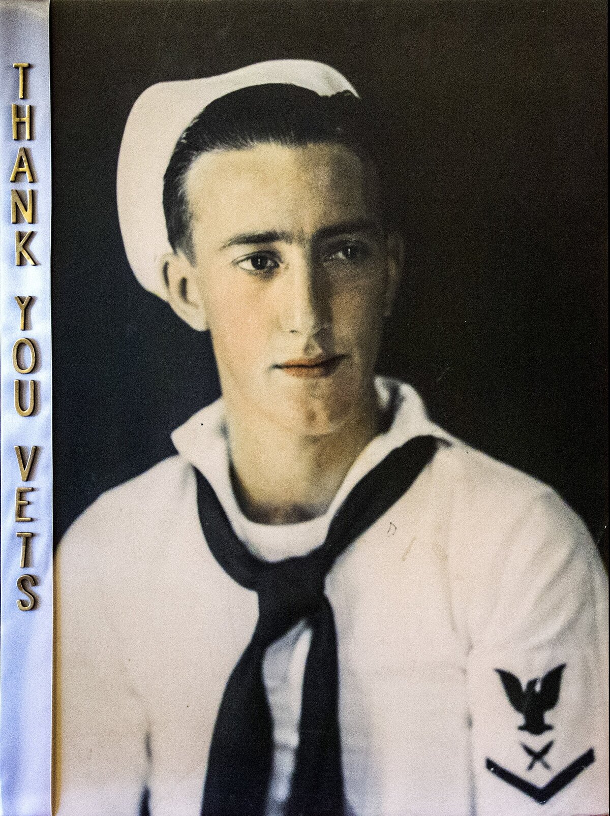 A photo of Marvin Snyder from his navy days during WWII was made into a placard.