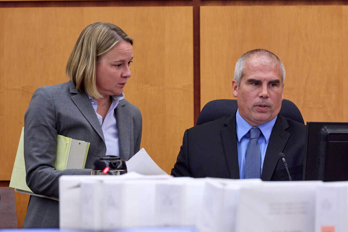 Washington state assistant attorney general Lori Nicolavo talks with Pierce County Sheriff’s Department Lt. Byron Brockway, lead investigator in the death of Manuel Ellis, as he testifies during the trial of Tacoma Police officers accused in the death of Ellis held at Pierce County Superior Court, Thursday, Oct. 26, 2023, in Tacoma, Wash. Officers Christopher Burbank, Matthew Collins and Timothy Rankine are charged. (John Froschauer / Pool Photo - AP)