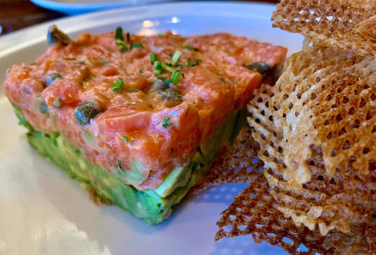 The wild salmon tartare served with housemade gaufrette chips is sure to become a signature dish at West 122.