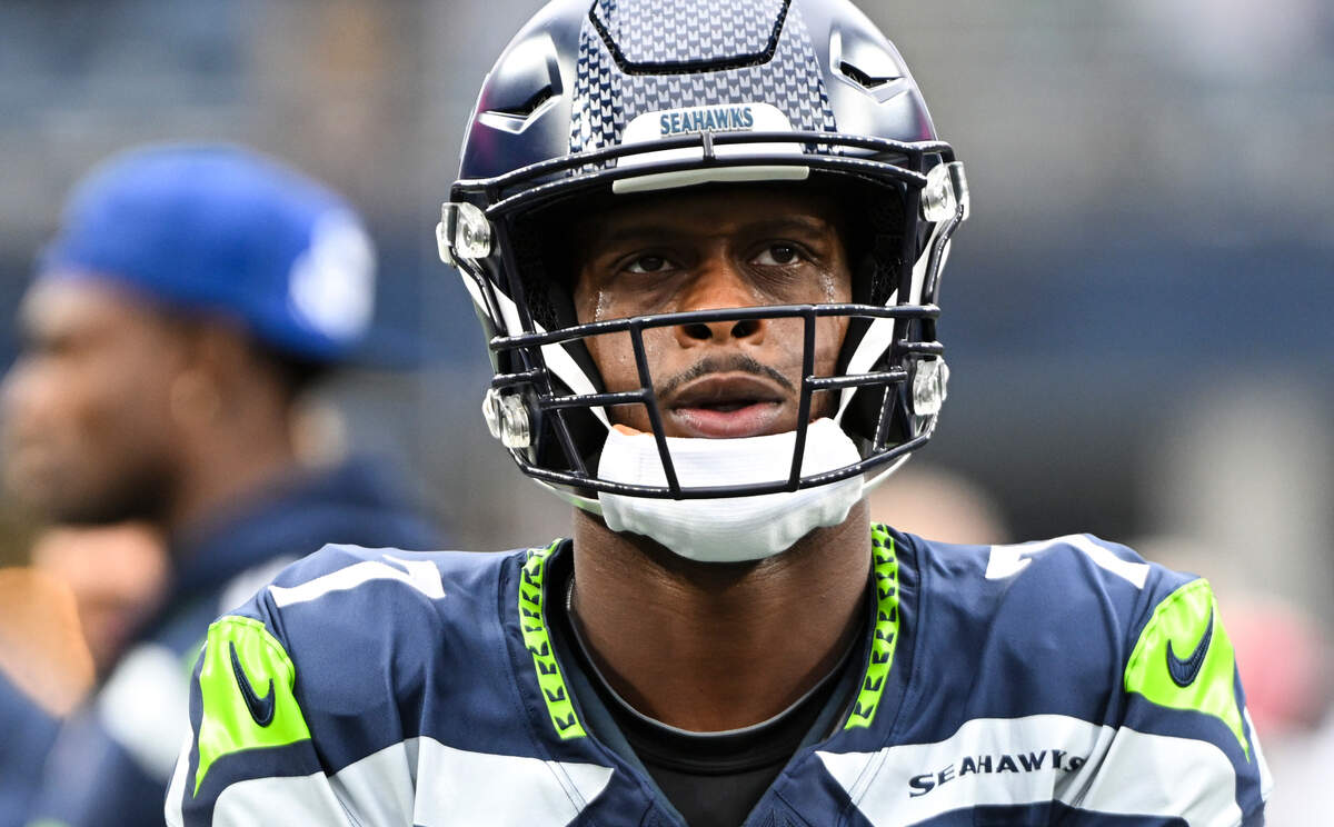 Seattle Seahawks quarterback Geno Smith (7) warms up before the game against the Arizona Cardinals at Lumen Field, Sunday, Oct. 22, 2023, in Seattle, Wash.