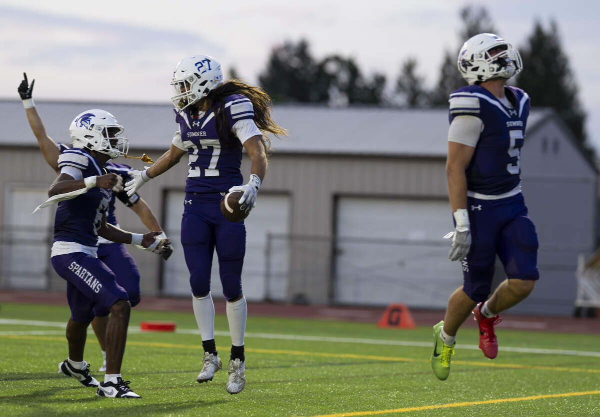 Sumner free safety Elias Isaacs (27) and teammates react to an interception against Kennedy Catholic Lancers during the first half of the game at Sunset Chev Stadium on Friday, Sept. 12, 2025, in Sumner.
