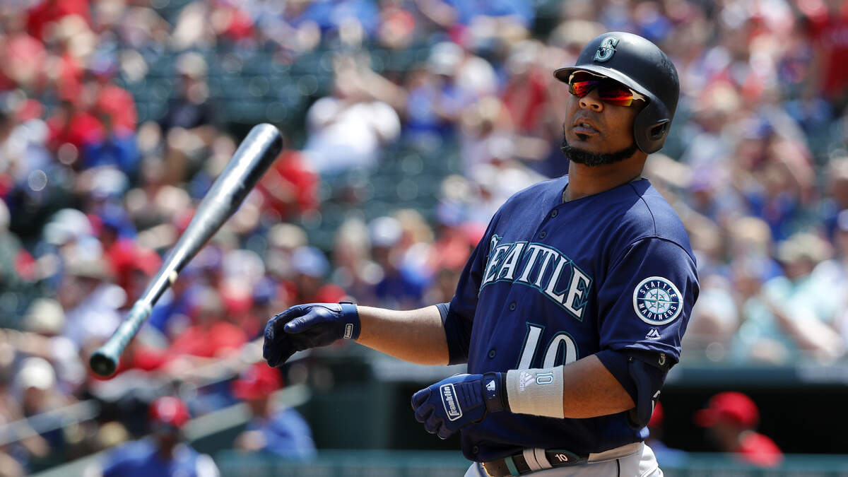 Seattle Mariners’ Edwin Encarnacion tosses his bat after striking out against Texas Rangers’ Ariel Jurado in the eighth inning of a baseball game in Arlington, Texas, Wednesday, May 22, 2019.